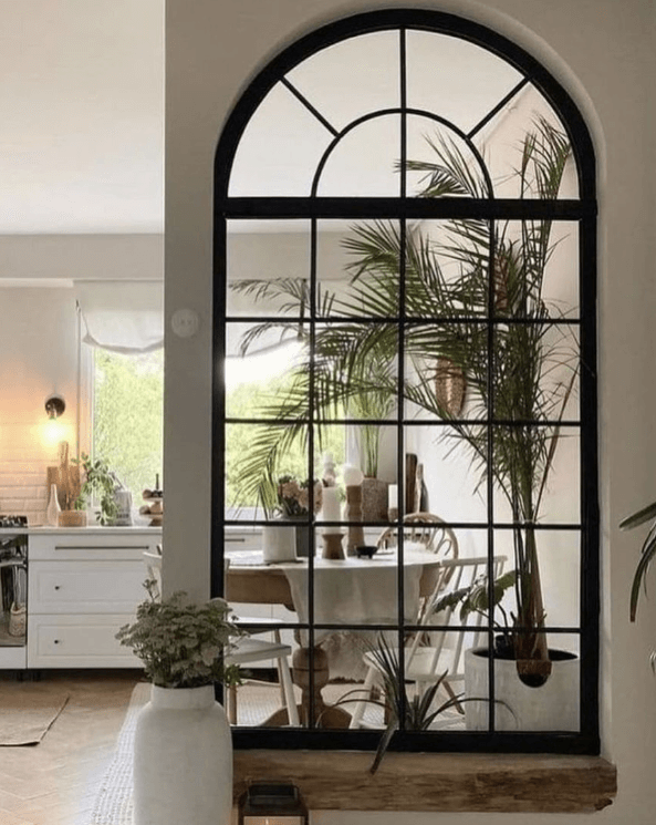 Place large mirrors opposite windows