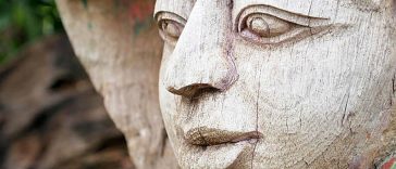 beautifully carved wooden face with expressive features