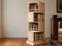 Finished four-tier DIY rotating bookshelf with alternating birch plywood cubbies on a square base