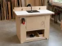 Finished DIY router table with cabinet base, adjustable fence and dust collection in a small woodworking shop