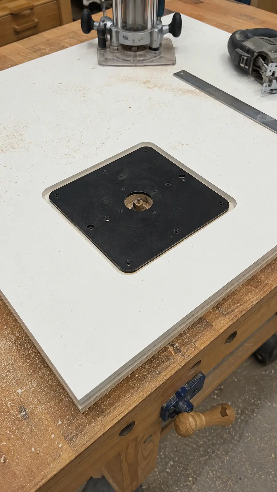 Router insert plate recess being cut into the tabletop
