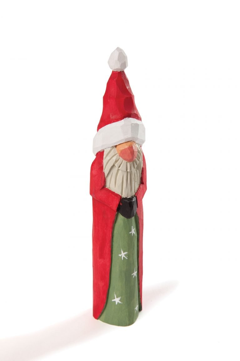 Red hand-carved Santa with a long white beard and folded arms