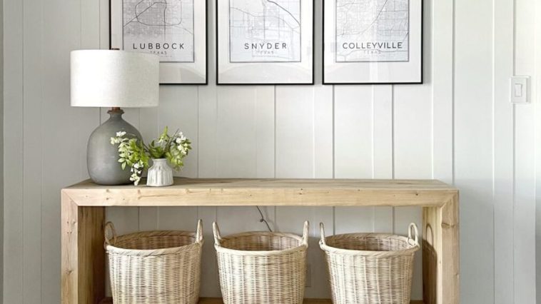 Modern waterfall console with baskets on the lower shelf