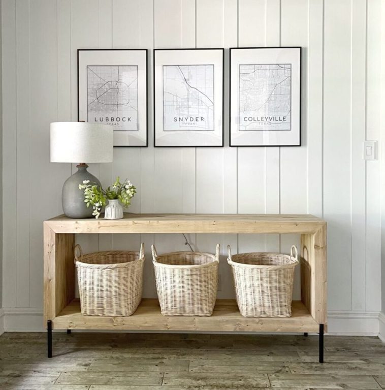 Modern waterfall console with baskets on the lower shelf