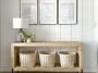 Modern waterfall console with baskets on the lower shelf