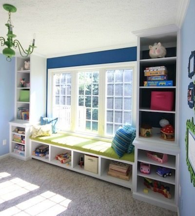 Reading window seat between bookcases with basket cubbies underneath