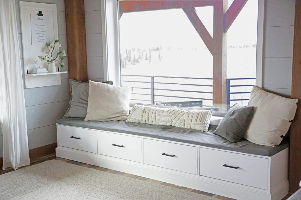 Custom window seat with drawers and a cushioned top